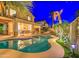 Sparkling backyard pool surrounded by lush landscaping and a covered patio, creating a private oasis at 3270 W White Canyon Rd, San Tan Valley, AZ 85144