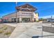 The San Tan Heights Center showcases a well-maintained building with inviting entrances and manicured landscaping under a clear blue sky at 3270 W White Canyon Rd, San Tan Valley, AZ 85144