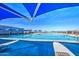 Beautiful community pool featuring shade structures, a splash pad, and ample space for relaxation, perfect for Gathering fun at 3270 W White Canyon Rd, San Tan Valley, AZ 85144