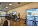 Community gym with a variety of cardio and strength training equipment and bright natural light at 3270 W White Canyon Rd, San Tan Valley, AZ 85144