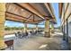 Inviting outdoor seating area with stone pillars, covered pergola, and scenic mountain views, perfect for community gatherings at 3270 W White Canyon Rd, San Tan Valley, AZ 85144
