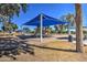 A playground with covered picnic areas, inviting families to enjoy outdoor play and leisurely picnics in a comfortable setting at 3270 W White Canyon Rd, San Tan Valley, AZ 85144