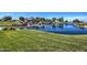 Picturesque lake and rock waterfall feature enhance the natural beauty of San Tan Heights at 3270 W White Canyon Rd, San Tan Valley, AZ 85144