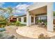 Expansive backyard with desert landscaping, tiled patio, and a glimpse of the home's exterior at 32771 N 70Th St, Scottsdale, AZ 85266