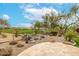 Landscaped backyard featuring desert flora, decorative rocks, and a cozy tile patio at 32771 N 70Th St, Scottsdale, AZ 85266