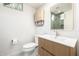 Bathroom featuring a sleek vanity, modern lighting, with a view of the shower with green tile at 32771 N 70Th St, Scottsdale, AZ 85266