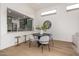 Cozy dining area with modern table, chairs, and a view of the stylish, green kitchen at 32771 N 70Th St, Scottsdale, AZ 85266