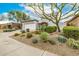 Well-maintained front yard showcasing desert landscaping and lush greenery, adding charm to the property at 32771 N 70Th St, Scottsdale, AZ 85266