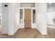 Inviting foyer with modern wood-look flooring and a stylish wooden front door at 32771 N 70Th St, Scottsdale, AZ 85266