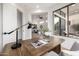 Cozy office with a desk, modern lighting, and views of a serene patio, perfect for focused work at 32771 N 70Th St, Scottsdale, AZ 85266