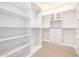 Spacious walk-in closet with ample shelving, drawers, and hanging rods for optimal organization at 32771 N 70Th St, Scottsdale, AZ 85266