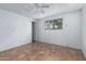 Bright bedroom with ceiling fan, tile flooring and window with backyard views at 339 E 9Th Dr, Mesa, AZ 85210