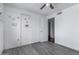 Bedroom with wood-look vinyl flooring, ceiling fan, and closet at 339 E 9Th Dr, Mesa, AZ 85210