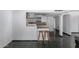 Kitchen featuring bar stool seating with bright white cabinetry at 339 E 9Th Dr, Mesa, AZ 85210