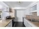 Functional kitchen featuring stainless steel gas range, granite counters, and white cabinets at 339 E 9Th Dr, Mesa, AZ 85210