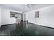 Bright living space featuring barstool seating and tile flooring, with access to the kitchen and hallway at 339 E 9Th Dr, Mesa, AZ 85210