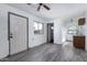 Additional living space showcasing tile floors, a kitchenette, and an entrance door with windows at 339 E 9Th Dr, Mesa, AZ 85210