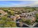 A serene neighborhood featuring cozy houses with well-kept yards and paved streets under a vast blue sky at 3678 E Yeager Ct, Gilbert, AZ 85295