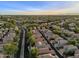 A picturesque aerial view of a neighborhood with well-spaced homes along tree-lined streets at 3678 E Yeager Ct, Gilbert, AZ 85295