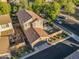 Aerial view of a two-story home with a landscaped backyard, covered patio, and two-car garage at 3678 E Yeager Ct, Gilbert, AZ 85295