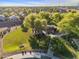 Aerial view showcases a large green park space complete with playgrounds and lots of tree coverage at 3678 E Yeager Ct, Gilbert, AZ 85295