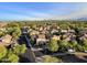 Panoramic aerial shot of homes with well-manicured lawns and tree lined street at 3678 E Yeager Ct, Gilbert, AZ 85295