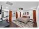 Bright bedroom featuring a ceiling fan, bed, exercise bike, and carpet at 3678 E Yeager Ct, Gilbert, AZ 85295
