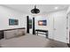 This bedroom features a flat-screen TV and a modern ceiling fan at 3678 E Yeager Ct, Gilbert, AZ 85295