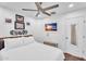 This bedroom features a ceiling fan, modern wood flooring, and wall-mounted decor at 3678 E Yeager Ct, Gilbert, AZ 85295