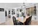 Bright dining room featuring a wooden table, modern chandelier, and sliding glass doors at 3678 E Yeager Ct, Gilbert, AZ 85295