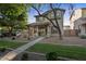 Inviting two-story home with desert landscaping, covered porch, and classic architectural details at 3678 E Yeager Ct, Gilbert, AZ 85295