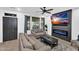 Stylish living room featuring a modern fireplace, large windows, and comfortable seating at 3678 E Yeager Ct, Gilbert, AZ 85295
