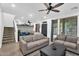 Open-concept living room featuring stairs, neutral color palette, and comfortable seating at 3678 E Yeager Ct, Gilbert, AZ 85295