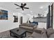 Spacious living room boasting tile flooring, ceiling fan, and modern furnishings at 3678 E Yeager Ct, Gilbert, AZ 85295