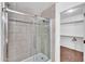 Modern tiled shower with glass door at 3678 E Yeager Ct, Gilbert, AZ 85295