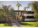 Inviting condo with well-maintained landscaping, mature trees, and open-air walkways to units at 3737 E Turney Ave # 223, Phoenix, AZ 85018