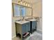 Bright bathroom featuring double sinks with modern fixtures and tiled flooring at 3737 E Turney Ave # 223, Phoenix, AZ 85018