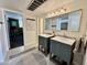 Bathroom featuring double sinks, modern lighting, and tiled flooring at 3737 E Turney Ave # 223, Phoenix, AZ 85018