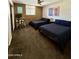 Spacious bedroom featuring two beds and a dedicated workspace at 3737 E Turney Ave # 223, Phoenix, AZ 85018