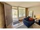 Welcoming entryway featuring a cozy sitting area and view to exterior patio at 3737 E Turney Ave # 223, Phoenix, AZ 85018