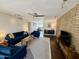 Inviting living room with stylish furnishings, brick accent wall, and wood-look flooring at 3737 E Turney Ave # 223, Phoenix, AZ 85018
