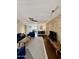 Open living area with contemporary decor, brick accent wall, and modern ceiling fan at 3737 E Turney Ave # 223, Phoenix, AZ 85018