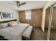 Comfortable main bedroom with a brick accent wall and ample closet space at 3737 E Turney Ave # 223, Phoenix, AZ 85018
