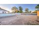 Spacious backyard with mature trees, block walls, and ample space for outdoor activities at 3906 W Aire Libre Ave, Phoenix, AZ 85053
