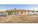 Spacious backyard featuring a covered patio and ample space for outdoor activities and lush green growth at 3906 W Aire Libre Ave, Phoenix, AZ 85053
