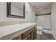 Bright bathroom features a tiled vanity and glass-enclosed shower at 3906 W Aire Libre Ave, Phoenix, AZ 85053