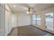 Spacious bedroom features a ceiling fan, closet, and sliding glass door at 3906 W Aire Libre Ave, Phoenix, AZ 85053