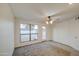 Light-filled bedroom has carpet, and a door leading to a patio at 3906 W Aire Libre Ave, Phoenix, AZ 85053