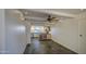 Bright dining room with kitchen view, ceiling fan, and tile floors at 3906 W Aire Libre Ave, Phoenix, AZ 85053