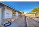 Exterior side featuring brick accents, large windows, and meticulously landscaped yard at 3906 W Aire Libre Ave, Phoenix, AZ 85053